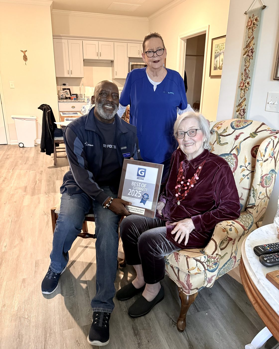 CareBuilders caregivers visiting a client at home with the Best of Gwinnett 2025 award